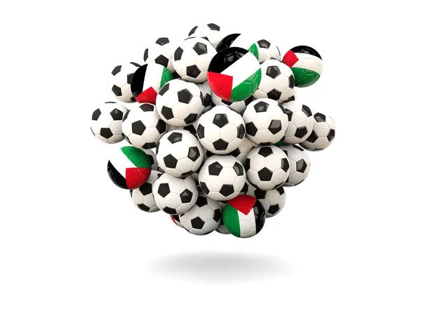 Mucchio di palloni da calcio con bandiera del territorio palestinese — Foto Stock