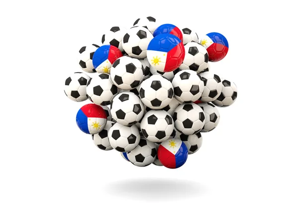 Pile de ballons de football avec drapeau de philippines — Photo