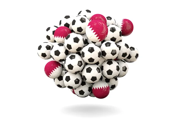 Mucchio di palloni da calcio con bandiera di qatar — Foto Stock