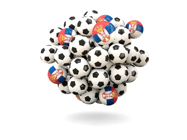 Mucchio di palloni da calcio con bandiera della serbia — Foto Stock