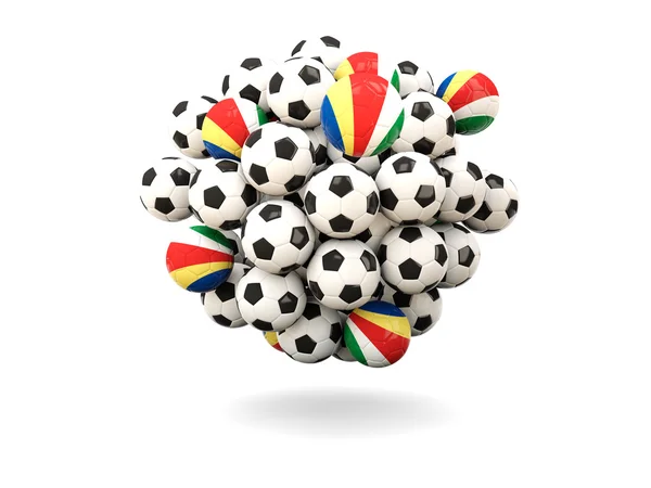 Hög med fotbollar med flagga Seychellerna — Stockfoto