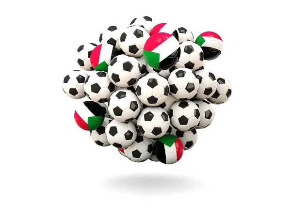 Pile of footballs with flag of sudan — Stock Photo, Image