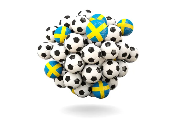 Stapel van voetballen met de vlag van Zweden — Stockfoto