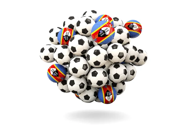 Mucchio di palloni da calcio con bandiera dello Swaziland — Foto Stock