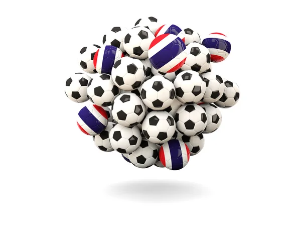Hög med fotbollar med flagga thailand — Stockfoto
