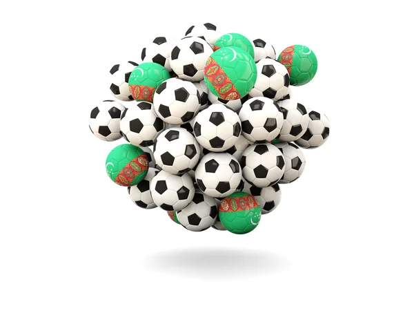 Pile of footballs with flag of turkmenistan — Stock Photo, Image