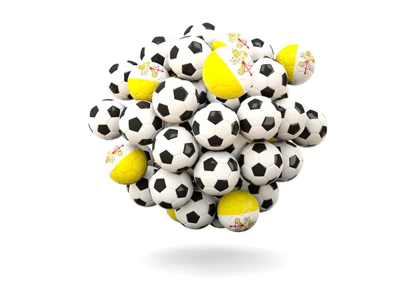 Груда футбольных мячей с флагом Ватикана — стоковое фото