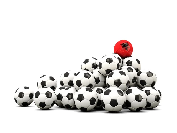 Mucchio di palloni da calcio con bandiera di albania — Foto Stock