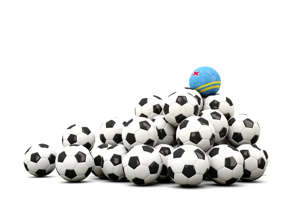 Mucchio di palloni da calcio con bandiera di aruba — Foto Stock