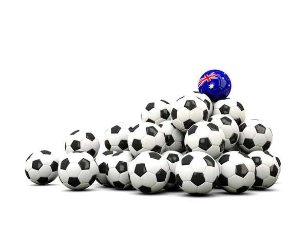 Högen av bollar fotboll med flagga Australien — Stockfoto