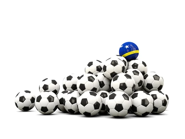 Mucchio di palloni da calcio con bandiera di curacao — Foto Stock