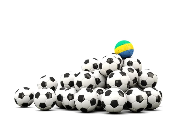 Mucchio di palloni da calcio con bandiera di Gabon — Foto Stock