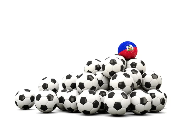 Stapel voetballen met de vlag van Haïti — Stockfoto