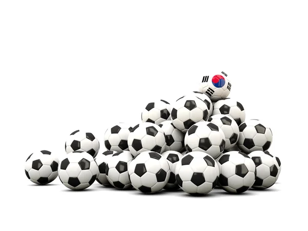 Högen av bollar fotboll med flagga korea south — Stockfoto