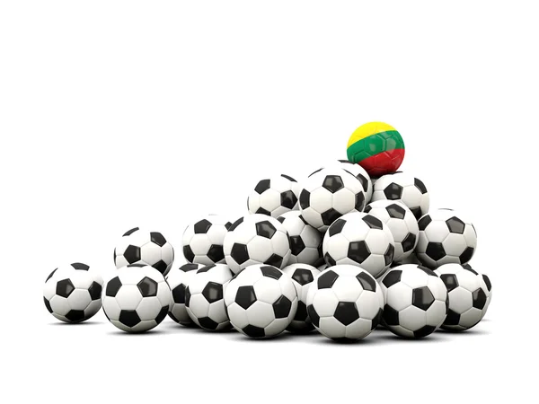 Pile de ballons de football avec drapeau de la lithuanie — Photo