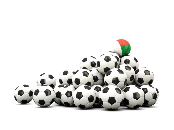 Mucchio di palloni da calcio con bandiera di madagvania — Foto Stock
