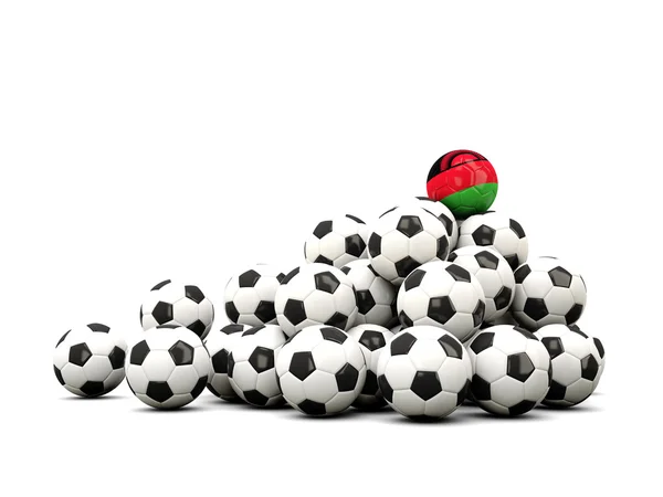 Pilha de bolas de futebol com bandeira do malawi — Fotografia de Stock