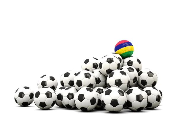 Σωρό από μπάλες ποδοσφαίρου με σημαία του Μαυρίκιου — Φωτογραφία Αρχείου