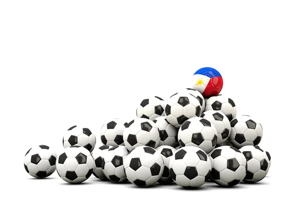 Σωρό από μπάλες ποδοσφαίρου με σημαία των Φιλιππίνων — Φωτογραφία Αρχείου