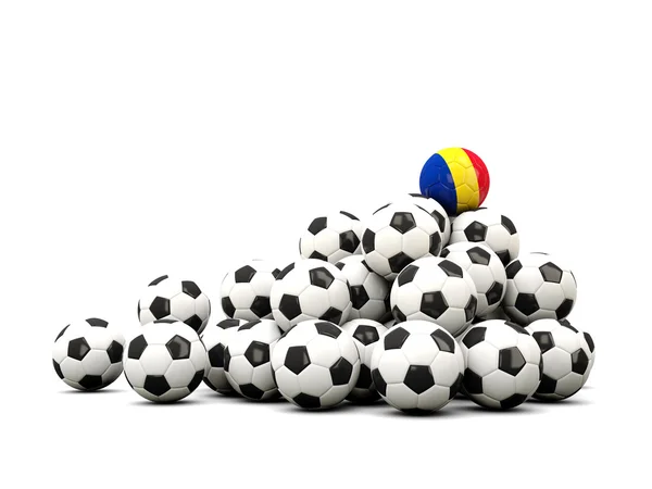 Mucchio di palloni da calcio con bandiera della Romania — Foto Stock
