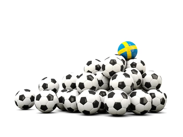 Högen av bollar fotboll med Sverige flagga — Stockfoto