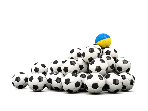 Högen av bollar fotboll med flagga Ukraina — Stockfoto