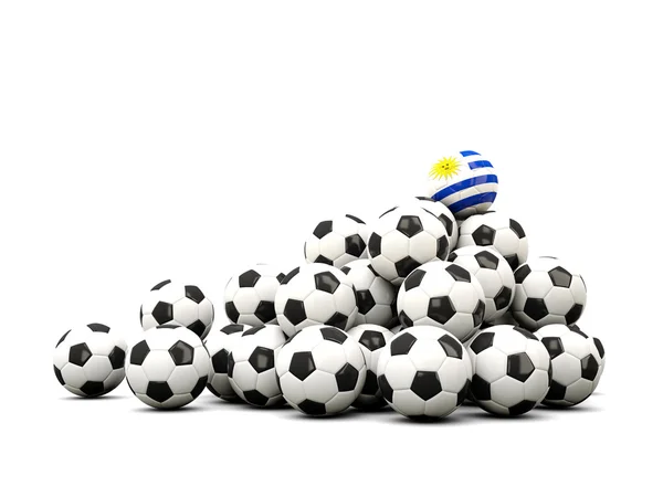 Futbol topu yığını ile uruguay bayrağı — Stok fotoğraf