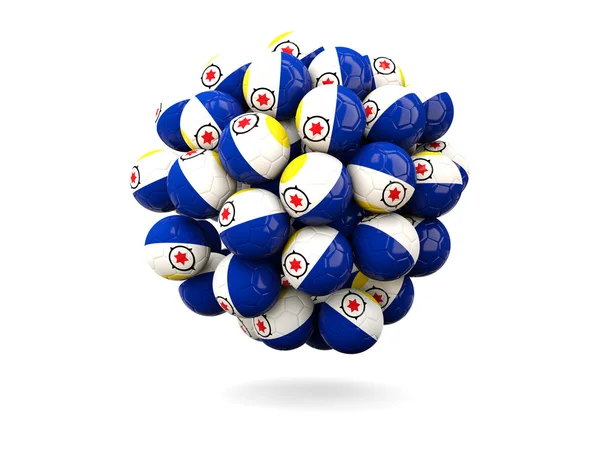 Pile de ballons de football avec drapeau de bonaire — Photo