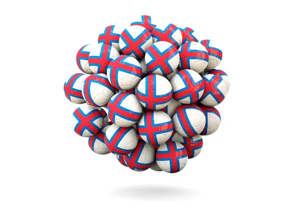 Куча футбольных мячей с флагом Фарерских островов — стоковое фото