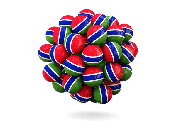 Pile de ballons de football avec drapeau de la gambie — Photo