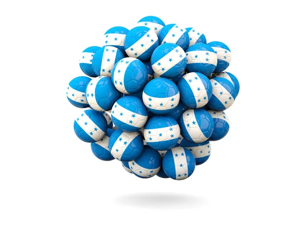 Pile of footballs with flag of honduras — Stock Photo, Image