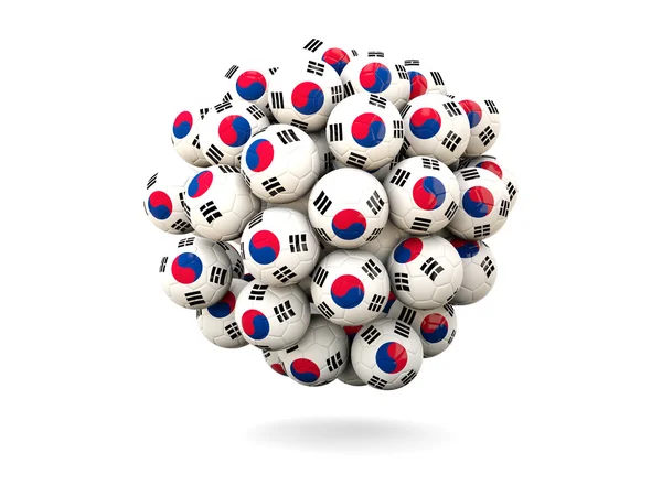 Mucchio di palloni da calcio con bandiera della Corea del Sud — Foto Stock