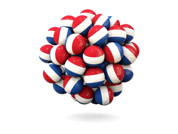 Mucchio di palloni da calcio con bandiera di paesi bassi — Foto Stock