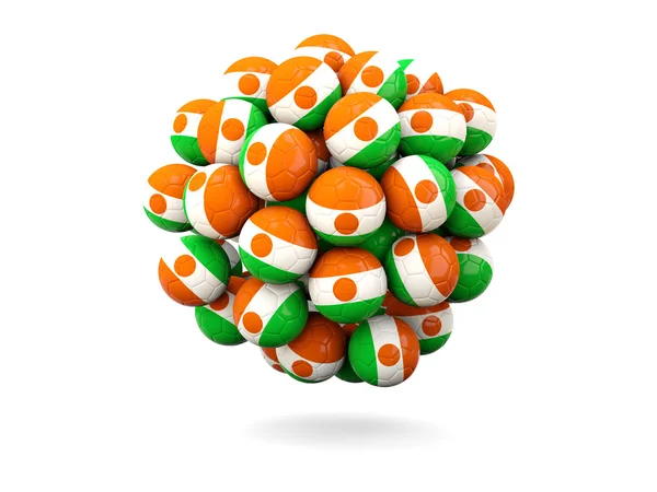 Montón de balones de fútbol con bandera de niger —  Fotos de Stock