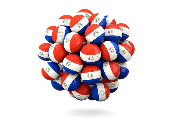 Pile de ballons de football avec drapeau du paraguay — Photo