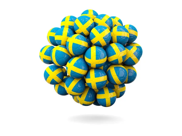 Mucchio di palloni da calcio con bandiera svedese — Foto Stock