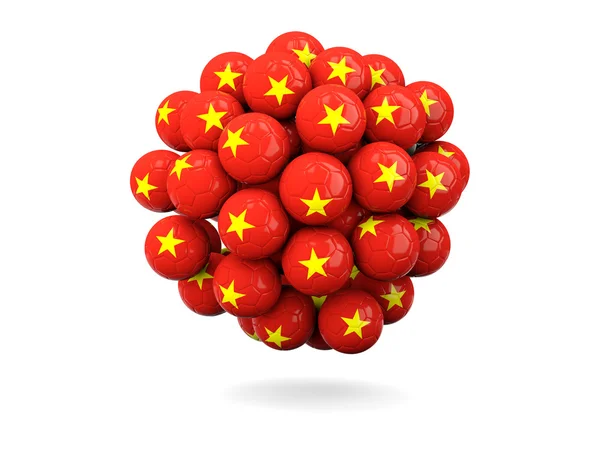 Mucchio di palloni da calcio con bandiera del Vietnam — Foto Stock