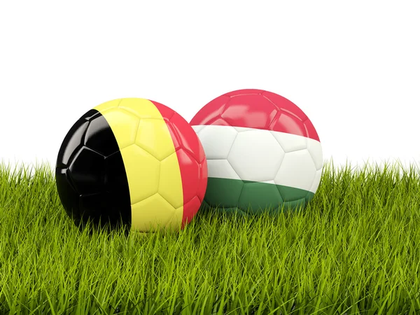 Hungary and Belgium soccer balls on grass — Stock Photo, Image