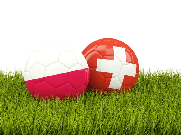 Schweiz och Polen fotbollar på gräs — Stockfoto