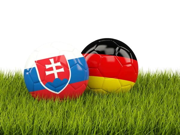 Germany and Slovakia soccer balls on grass — Stock Photo, Image