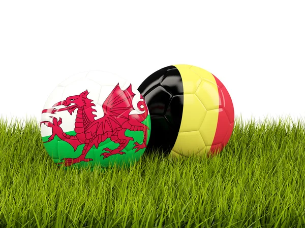 Wales and Belgium soccer  balls on grass — Stock Photo, Image