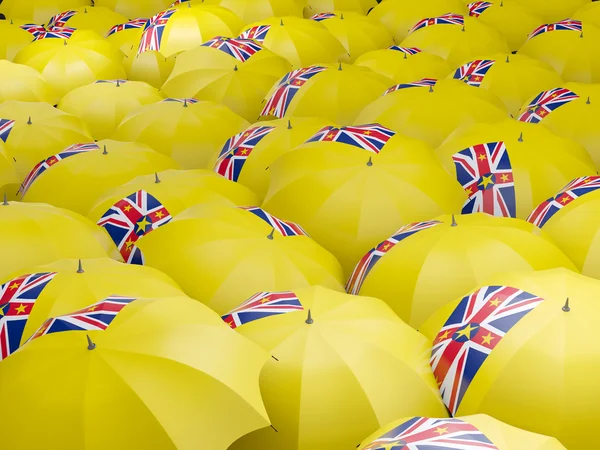 Umbrellas with flag of niue — Stock Photo, Image