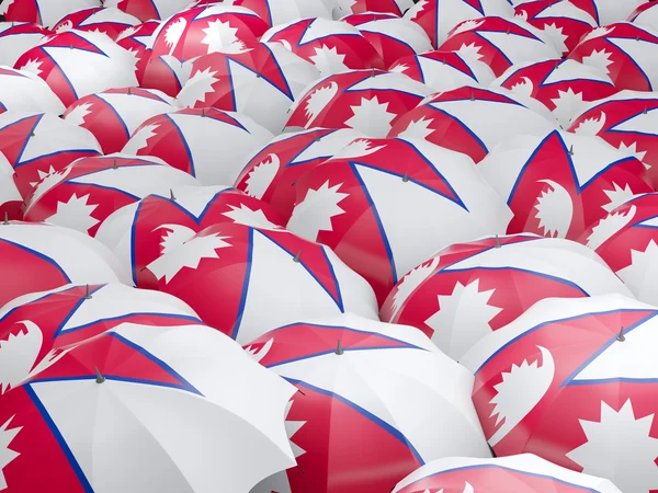 Зонты с флагом Непала — стоковое фото