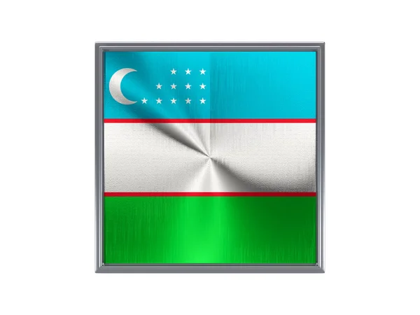 Square metal button with flag of uzbekistan — Stock fotografie