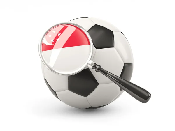 Football with magnified flag of singapore — Stockfoto