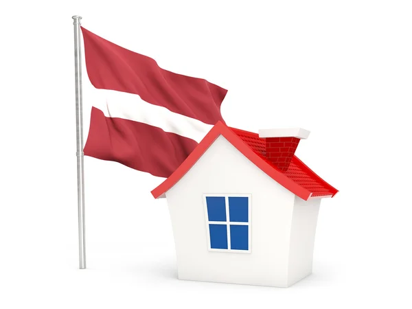 Casa com bandeira de latvia — Fotografia de Stock