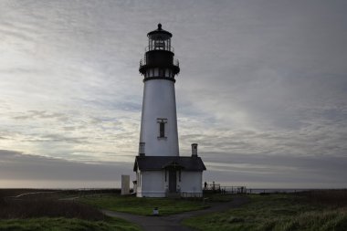 Yaquina Bay Lighthouse Newport Oregon Against Cloudy Sky clipart