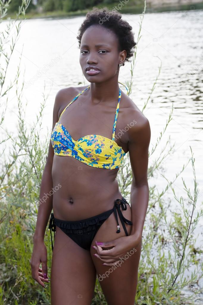 Skinny Black Teen Girl Bathing Suit By River Stock Photo by