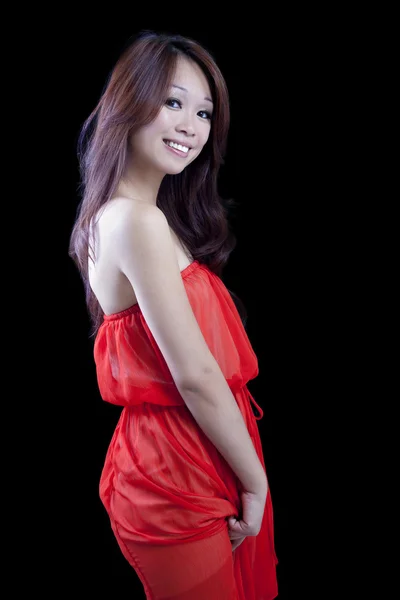 Sorrindo atraente asiático americano mulher laranja vestido — Fotografia de Stock