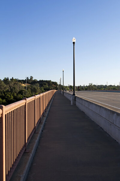 Empty Pedestrian Walkway Over Bridge Morning Blue Sky